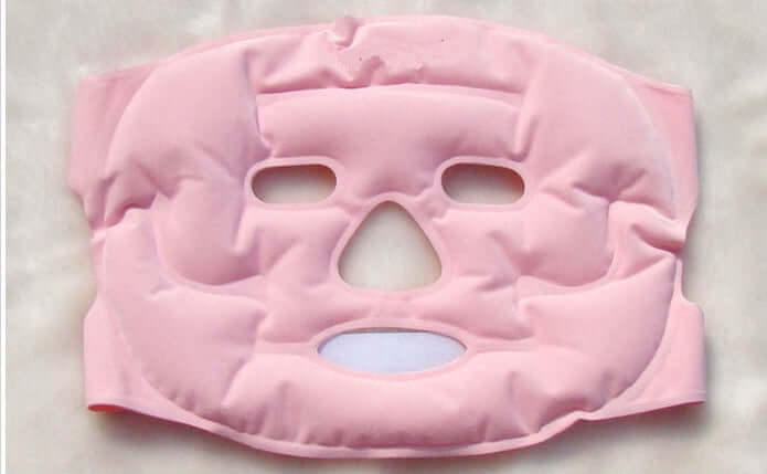 Pink beauty moisturizing whitening face mask designed for skincare and rejuvenation with eye and mouth openings.