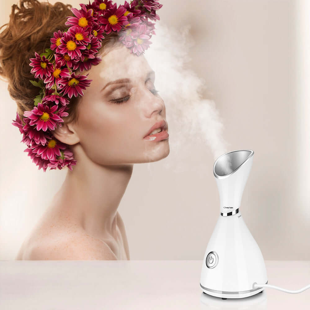 Beauty steamer facial moisturizer in use with model, releasing steam for hydration and skincare.