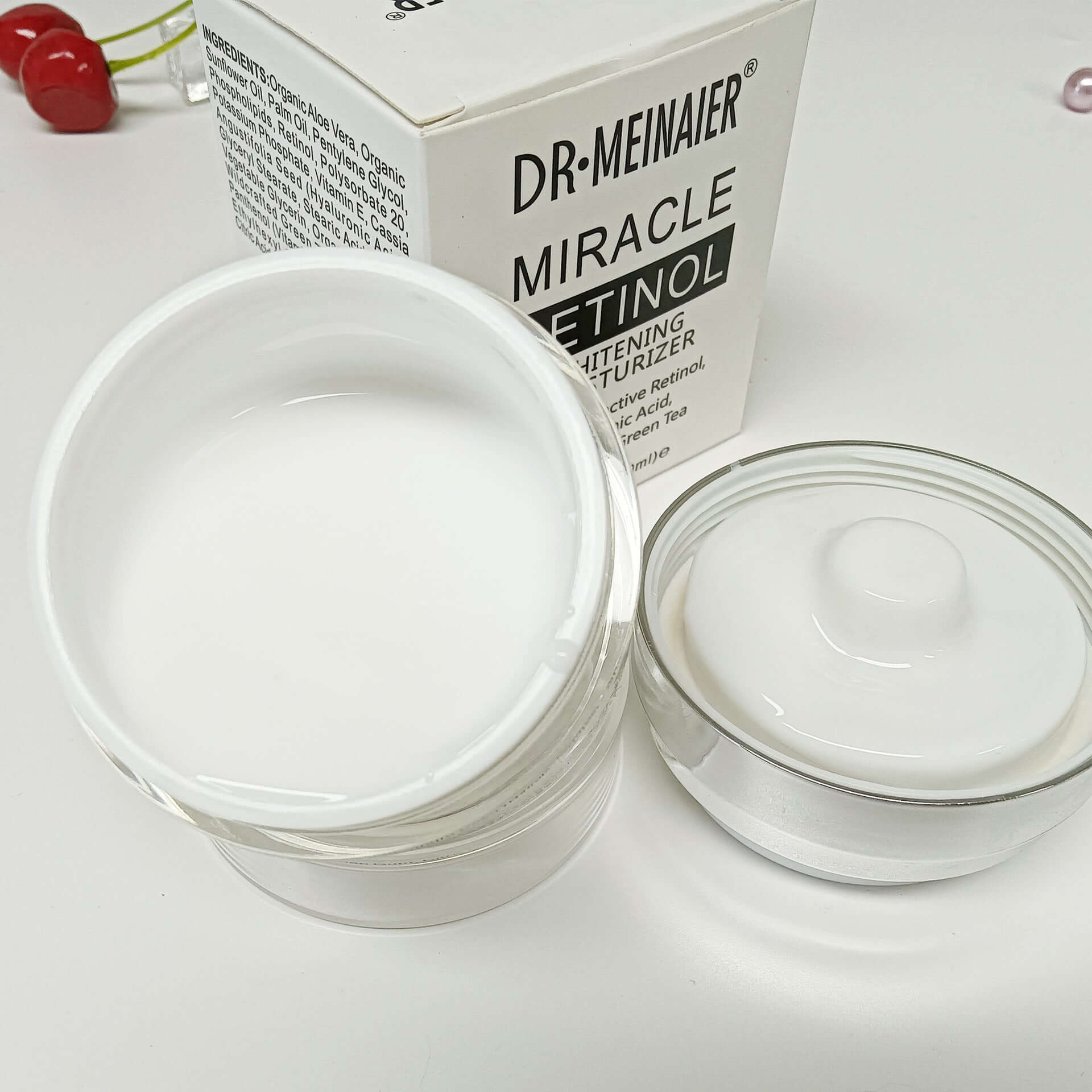Dr. Meinaier Miracle Retinol Moisturizing Cream in a glass jar with lid, perfect for shrinking pores and restoring skin.