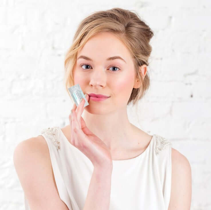 Model applying Forever Young Eye Cream in 03ml on her face, showcasing hydration and beauty.