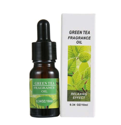 Green tea fragrance oil in a dropper bottle with box, promoting relaxation and soothing aroma for aromatherapy.