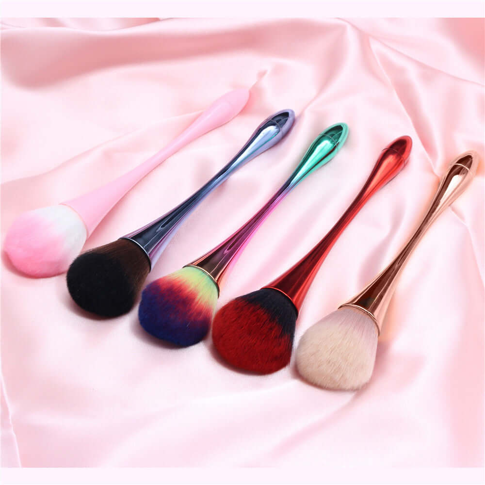Colorful professional cosmetic brushes on pink satin, ideal for flawless makeup application without streaks.