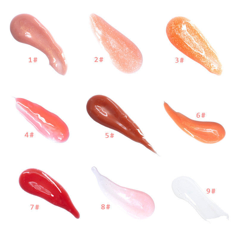 Variety of plumping lip gloss with vitamin E shades and textures displayed on a white background.