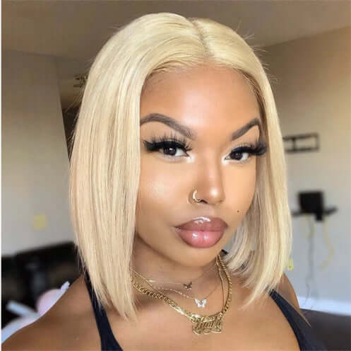 Short straight 613 blonde bob wig on a woman, showcasing a sleek hairstyle and natural look.