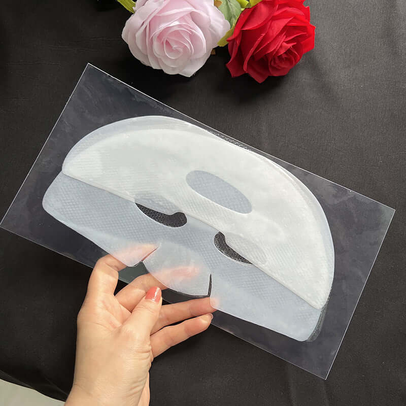 Collagen crystal jelly facial mask held in hand, designed for moisturizing all skin types, with floral background.