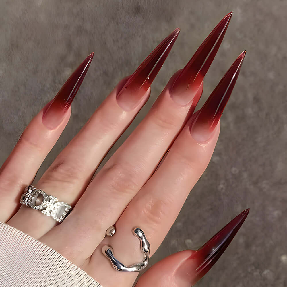 Elegant wine red gradient long drop-shaped fake nails with shiny finish, perfect for stylish nail art.