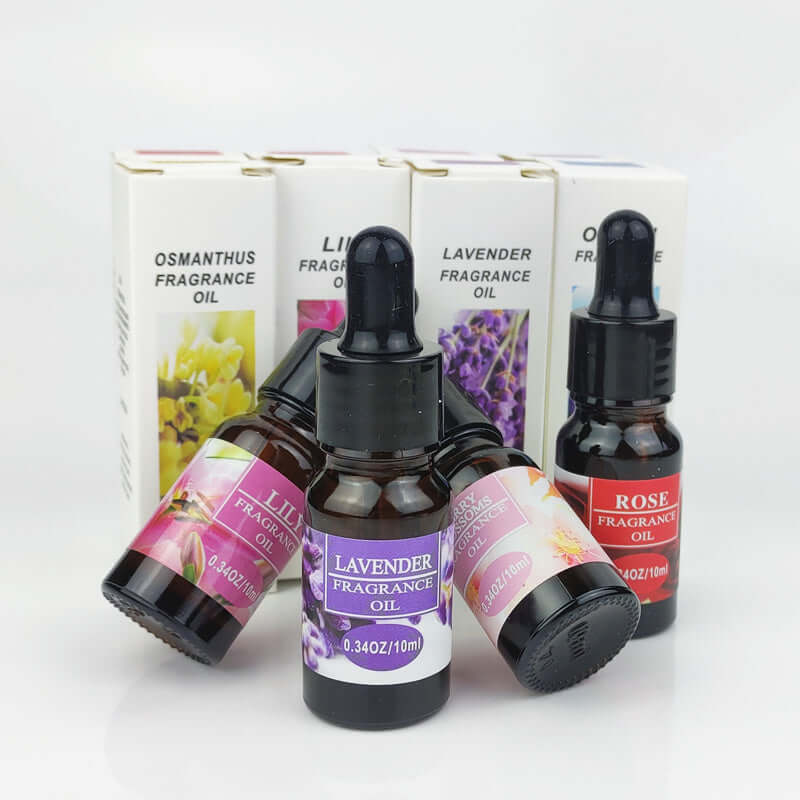 Essential oils for aromatherapy: Lavender, Rose, Lily, and Osmanthus scents in 10ml bottles.