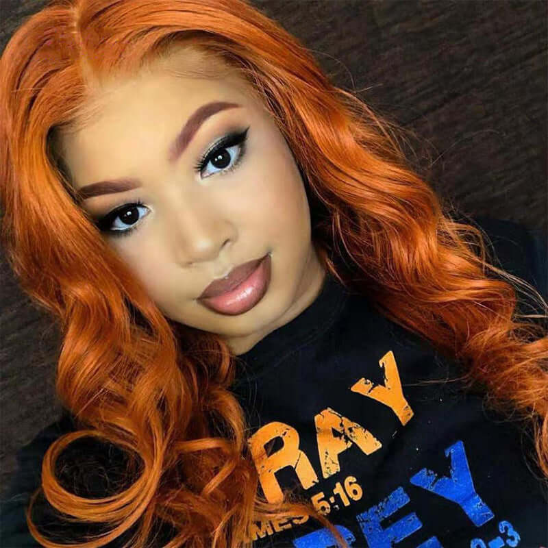 Smooth dark orange wig on a lady with makeup, showcasing exotic style and hair quality.