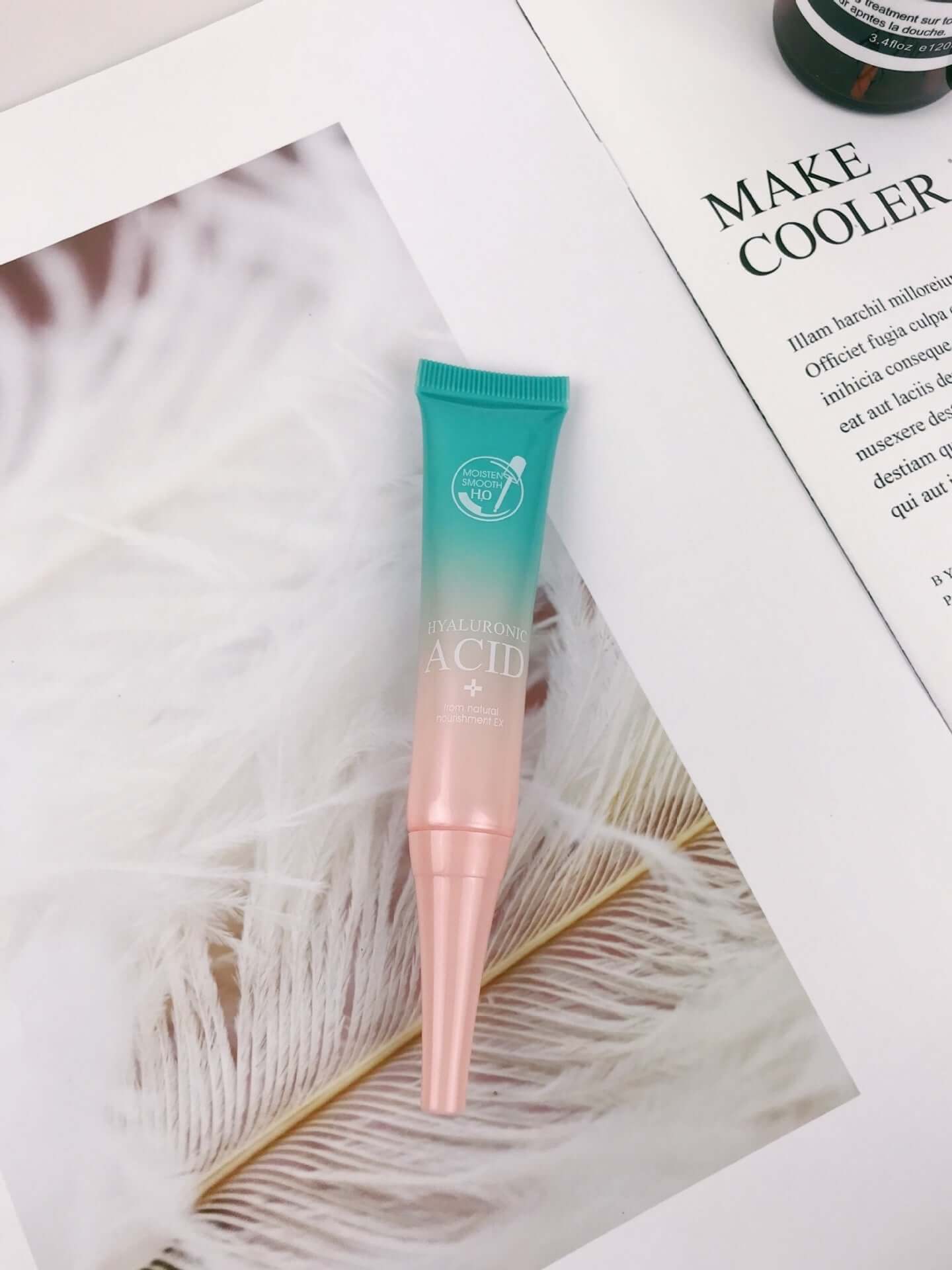 Hyaluronic acid facial care product in a tube on soft textured background, promoting moisturizing benefits for universal skin types.