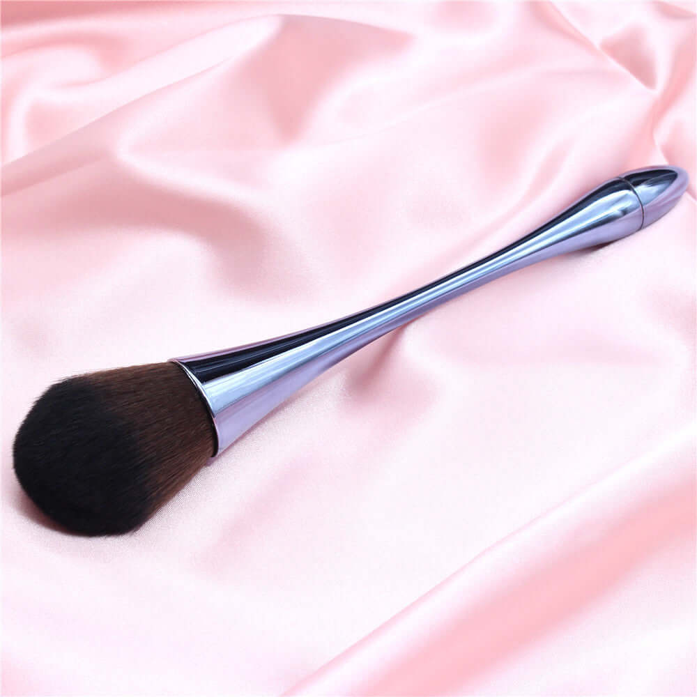 Professional high-quality makeup brush on satin fabric, designed for flawless application without streaks.