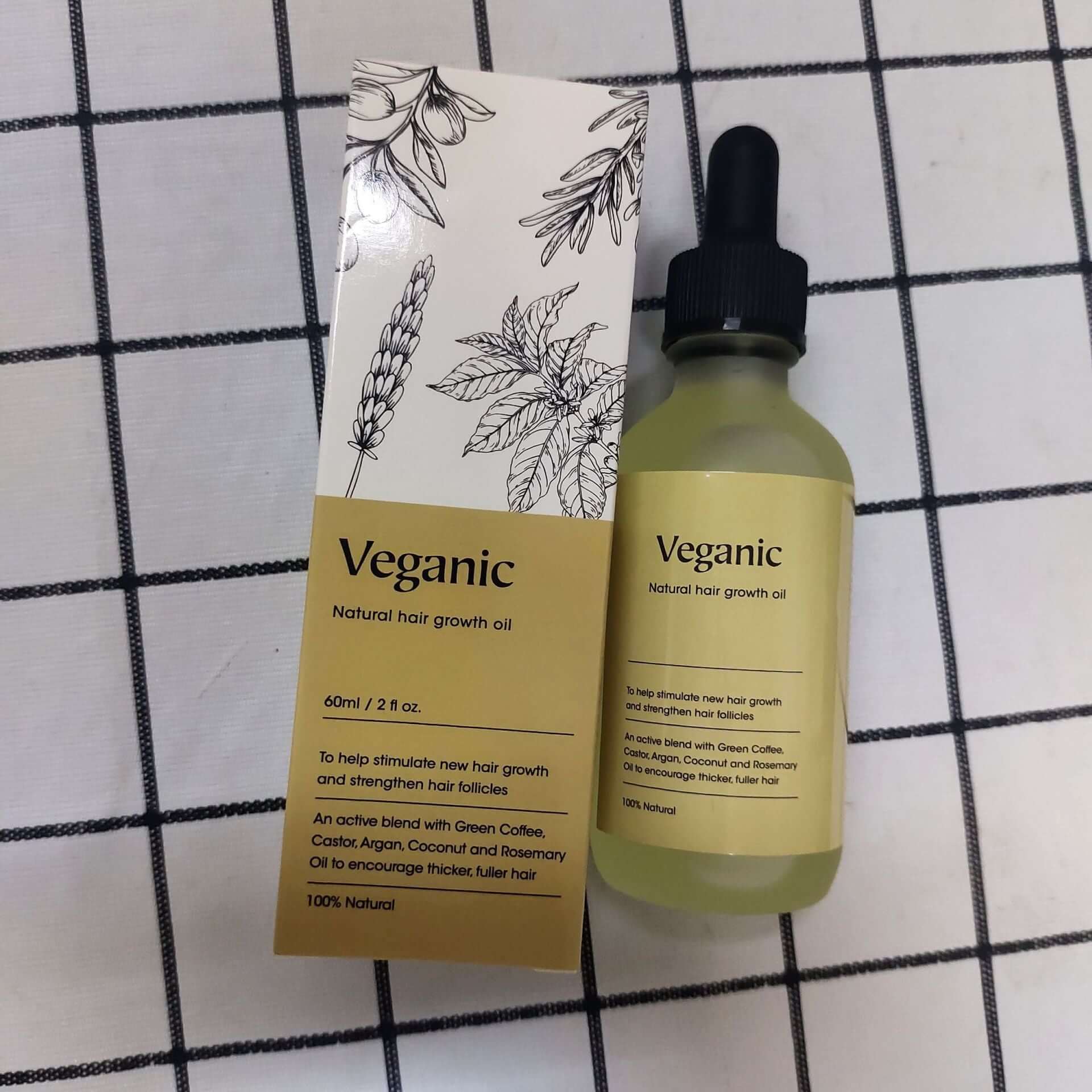 Veganic natural hair growth oil in a 60ml bottle, promoting hair growth and strengthening hair follicles.